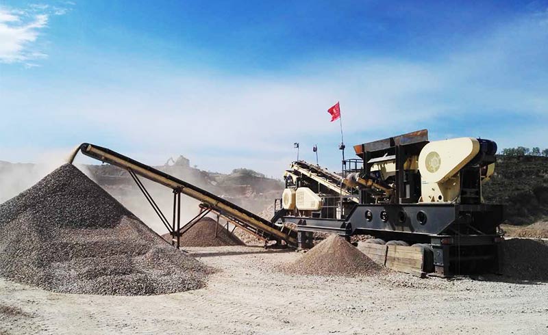 mobile jaw crusher crushing rock stone scene